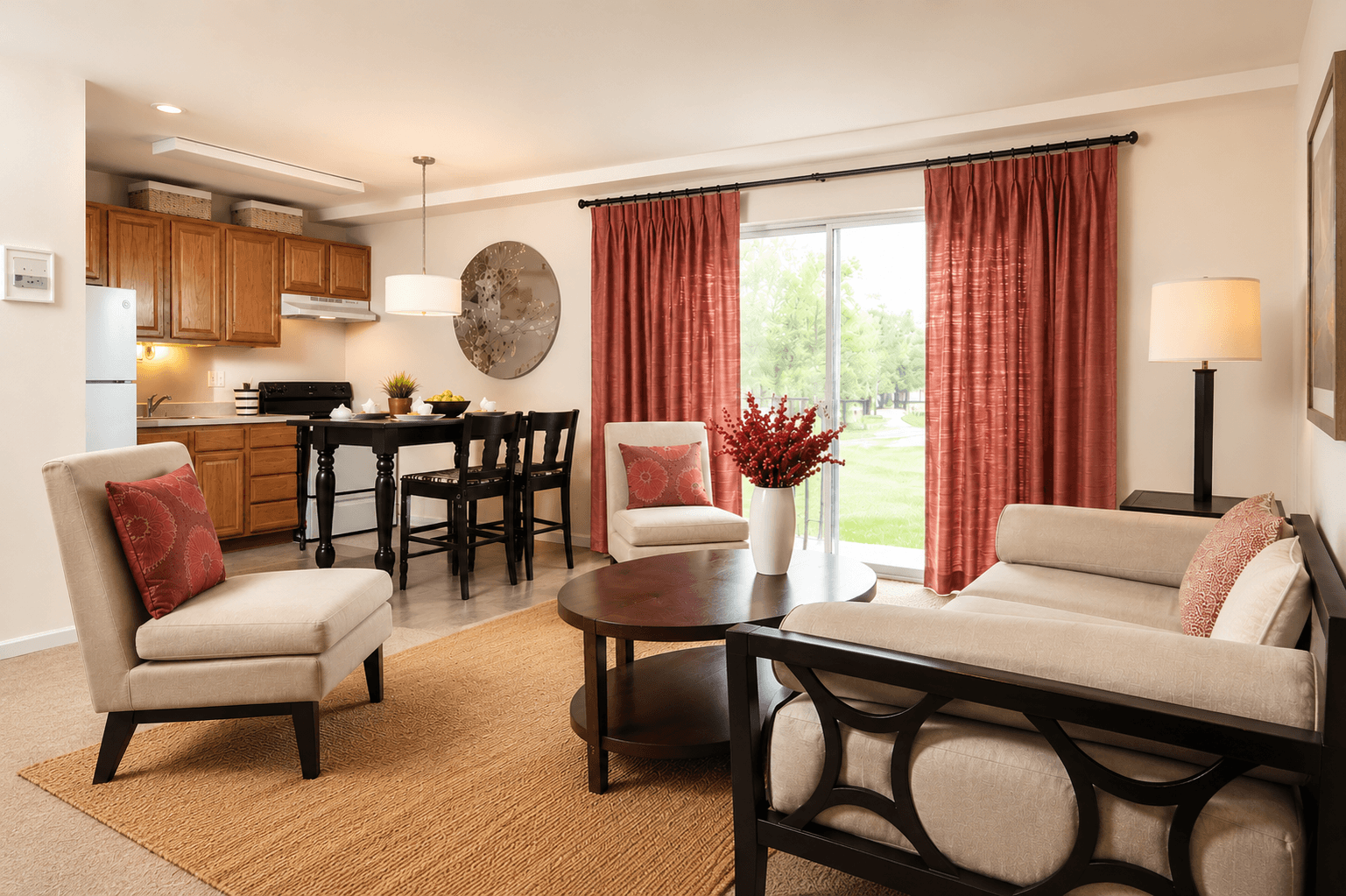 A living room with a couch, chair, and dining table.